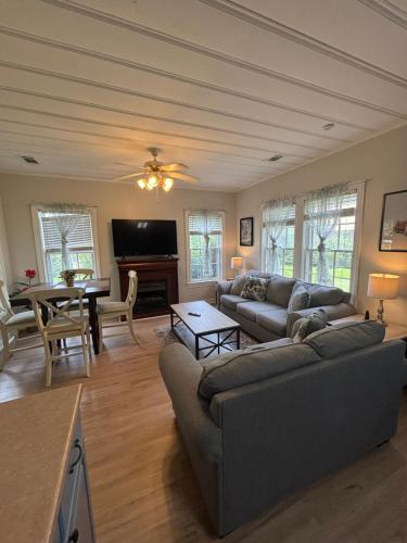 a living room with a couch and a table at Belle of the Burg in Hattiesburg