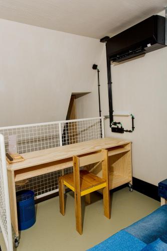 a wooden desk in a room with a table at JAM Ghent in Ghent