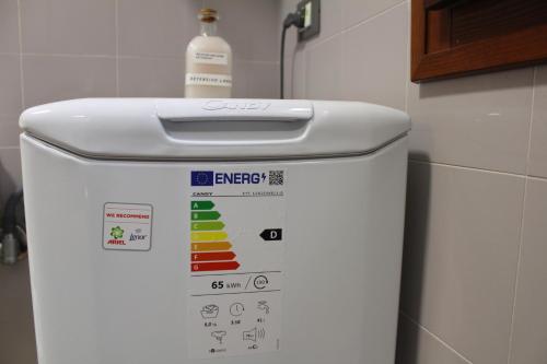 a bottle of water sitting on top of a refrigerator at Argenta Center every comfort in Argenta