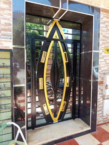 a glass door with an umbrella inside of it at À mi-chemin in Larache