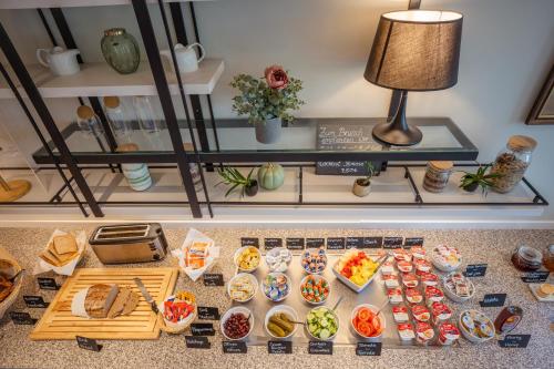 a table filled with different types of food at Hotel Bessunger Forst in Roßdorf