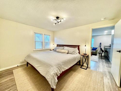a bedroom with a bed and a window at The Luxe in Marion