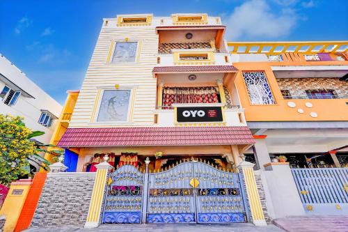 a building with a gate in front of it at Hotel O Enclave Stayz Inn in Chennai