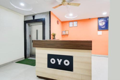 an office with an ovo sign on the door at Hotel O Sangareddy Formerly Ragas Grand in Patancheru