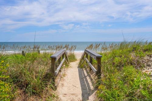 a path leading to a sandy beach with the ocean at Southern Dunes home by Peace Vacations in Georgetown