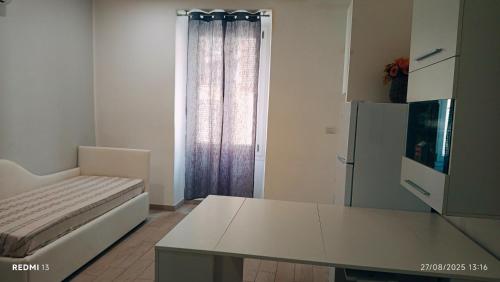 a living room with a couch and a table at Dimora Iosto in Sassari