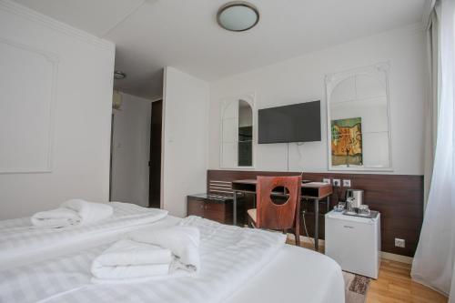 Postel nebo postele na pokoji v ubytování Hotel Attaché l contactless check-in