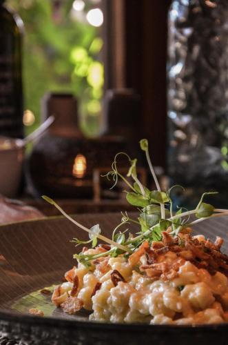a plate of food with pasta on a table at Hotel Ehrwalderhof in Ehrwald