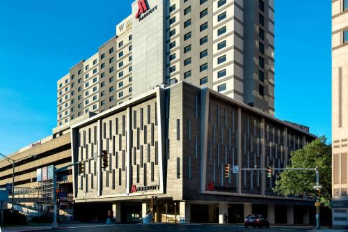 a large building with a flag on top of it at Marriott Springfield Downtown in Springfield