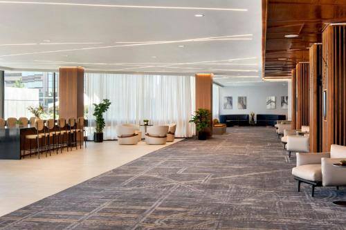 a large lobby with chairs and a waiting room at Marriott Springfield Downtown in Springfield