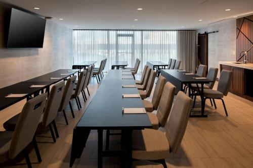 a row of tables and chairs in a restaurant at Marriott Springfield Downtown in Springfield