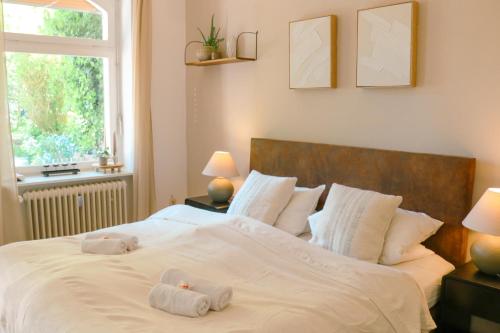 Ένα ή περισσότερα κρεβάτια σε δωμάτιο στο Big-size Bett Gartenapartment