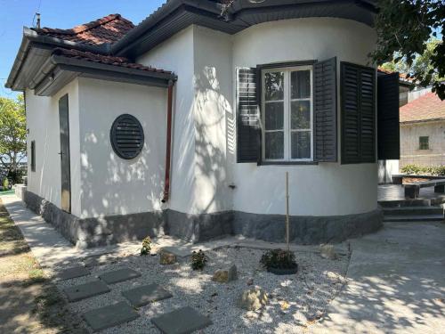 a statue of a woman on the side of a house at Sunset Beach House in Fonyód