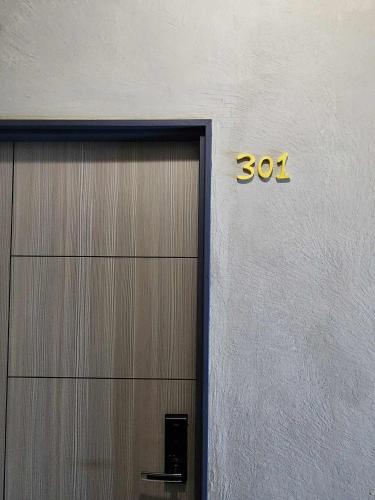 a door to a building with the number on it at In68 House in Ch'ih-k'an-lou