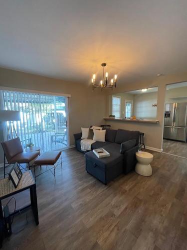 a living room with a couch and a table at Modern Comfort Near Colleges Perfect Mid Term Stay in Wilkes-Barre