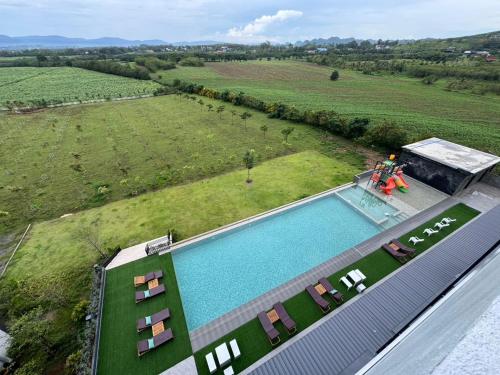 an overhead view of a swimming pool in a field at GrandWara Khao Yai แกรนด์วารา เขาใหญ่ in Ban Nong Song Hong