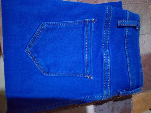 a pair of blue jeans sitting on a table at Nyabush fedha comfort suites in Nairobi