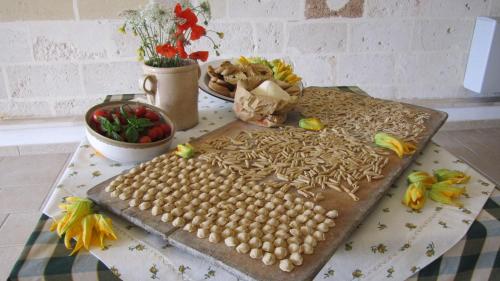 a table with a tray of food on a table at Masseria Giustiniani in Torricella