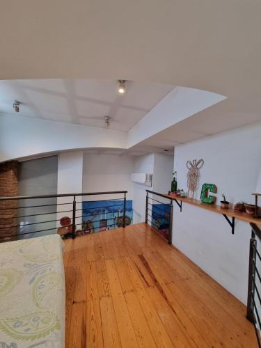 a living room with a couch and a wooden floor at el nido! Private stay at nice apartment North blvd Saltillo Mexico in Saltillo