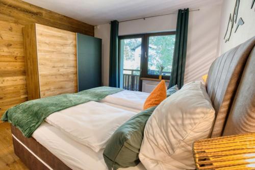 Postel nebo postele na pokoji v ubytování Waldblick by Dollop Living