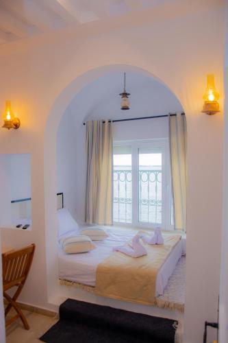 Katil atau katil-katil dalam bilik di Hôtel Al Jazira Mahdia