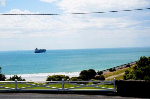 a view of the ocean with a ship in the water at Accommodation Portland Victoria in Portland