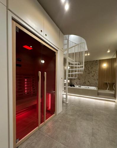a lobby with a glass door and a staircase at House Spa Palermo in Palermo