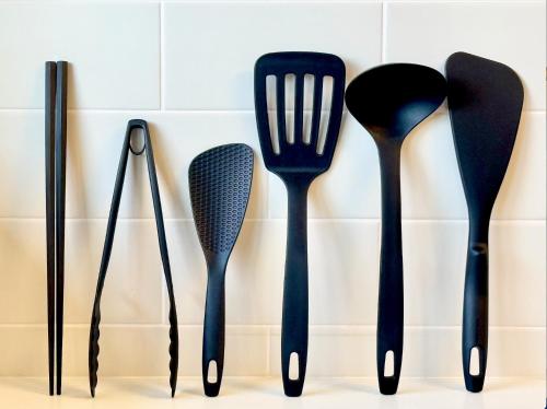 four utensils are lined up against a wall at FUWARI-kumamoto- in Aso