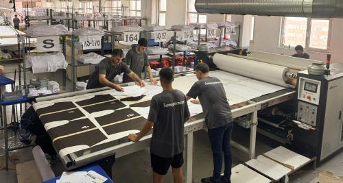 a group of men working in a factory with a machine at ibrahim tatlıses in Imarine