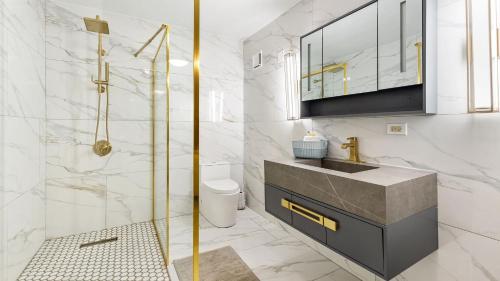 a bathroom with a sink and a shower at Landing View 203 with private rooftop terrace in Rincon