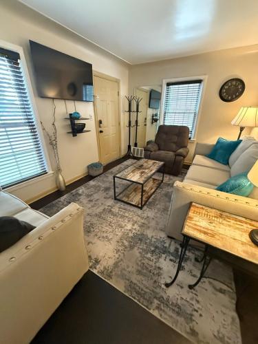 a living room with a couch and a table at Home Away from Home in Wyandotte