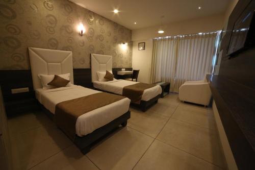 Ένα ή περισσότερα κρεβάτια σε δωμάτιο στο Hotel Arizona Inn