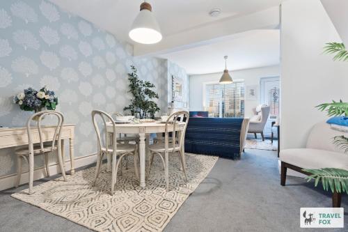 a dining room with a table and chairs at Seagull Cottage in Hunstanton