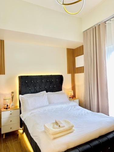 Postel nebo postele na pokoji v ubytování Twin Lakes Tagaytay - Uni Magical Suite