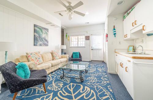 a living room with a couch and a table at Gypsea Rose in Southern Shores