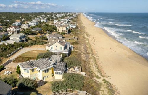 an aerial view of a beach with houses and the ocean at Gypsea Rose in Southern Shores