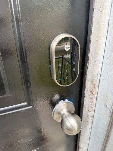 a door with a lock and a knob on it at Home Away from Home in Wyandotte