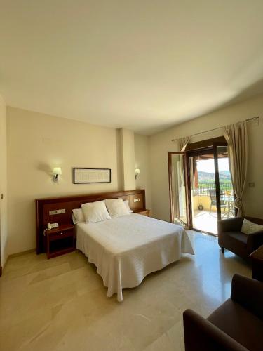 Ένα ή περισσότερα κρεβάτια σε δωμάτιο στο Hotel San Sebastián Hospedería