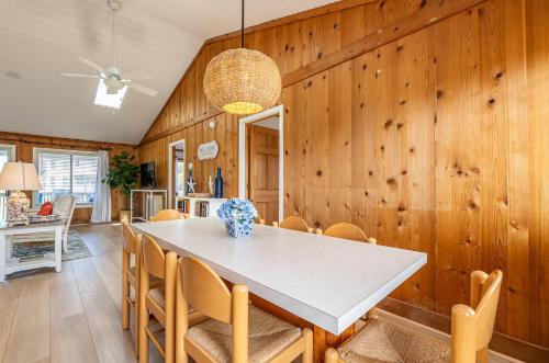 a dining room with a table and chairs at High Tides - D3850 in Duck