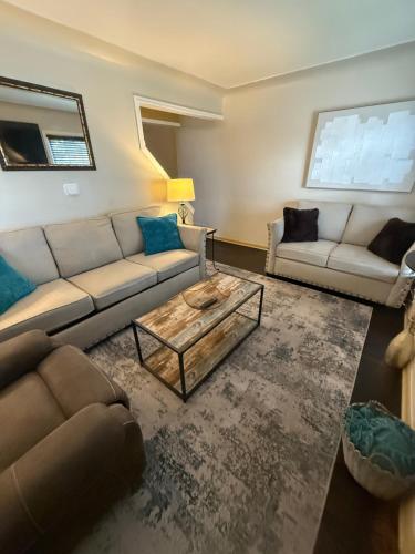 a living room with two couches and a coffee table at Home Away from Home in Wyandotte