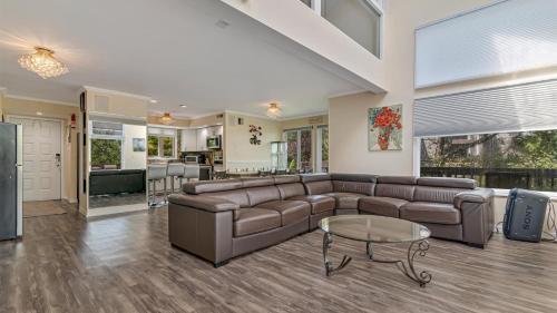 a living room with a couch and a table at The Best Views From Camelback in Tannersville