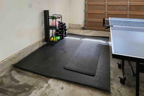 a gym with a black mat in a room at Evergreen at Semiahmoo in Blaine