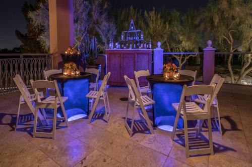 a set of tables and chairs with a stage in the background at Scottsdale Marriott at McDowell Mountains in Scottsdale