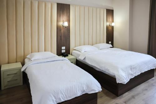 Postel nebo postele na pokoji v ubytování Gardenland Resort