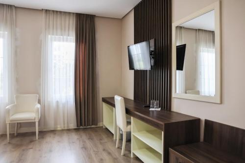 TV a/nebo společenská místnost v ubytování Gardenland Resort