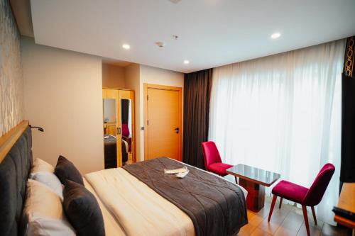 Ένα ή περισσότερα κρεβάτια σε δωμάτιο στο Hotel Yaman
