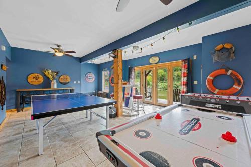 a living room with a ping pong table in it at Log Home on Williamstown Lake - Near Ark in Dry Ridge