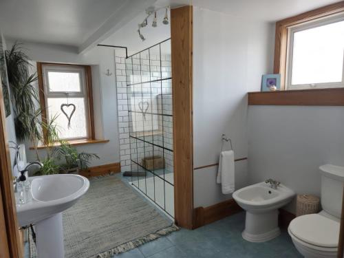 a bathroom with a toilet and a sink at The Old Rectory in Largs