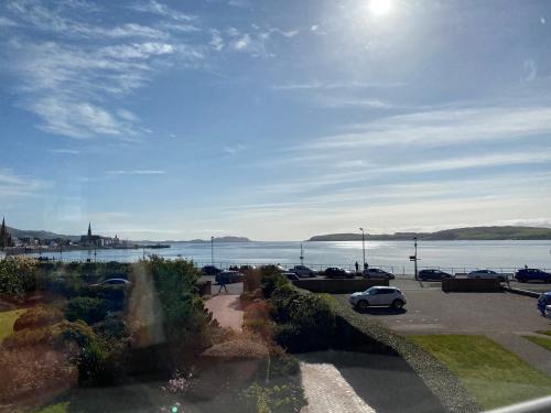 a view of a parking lot next to a body of water at The Old Rectory in Largs