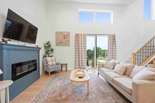 a living room with a couch and a tv at Dry Ridge Retreat - Near Ark - with Hot Tub in Dry Ridge